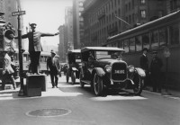 Anonymous – A Policeman is Directing Traffic on Kearny Street