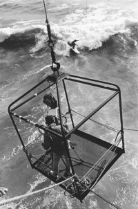 Huntington Beach and TV Cameraman in cage, circa 1963