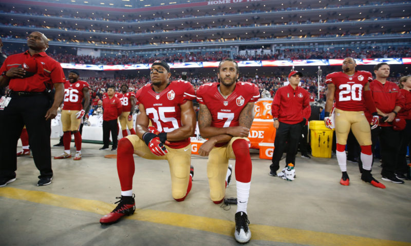 Michael Zagaris,Colin Kapernick Taking a Knee for Justice with Eric Reed, 2016