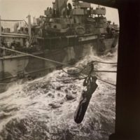 Transferring Rescued Pilot from Destroyer to Carrier, 1942
